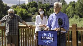 Gubernatorial candidate Mike Cooney announces his economic plan for the state during a July 30 press conference in Missoula. Todd Frank and Whitney Williams look on.