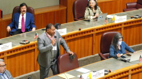 Democratic state Sen. Harold Pope, of Albuquerque, speaks to the New Mexico state Senate in Santa Fe, N.M., on Tuesday, April 5, 2022. The Legislature was vetting a bill that would provide tax rebates and payments to offset the rising consumer prices. More than a dozen states are considering or implementing payouts to the public in response to raging inflation and budget surpluses. (AP Photo/Morgan Lee)