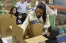 Commissioner-elect Nikki Fried boxing produce at Second Harvest of the Big Bend