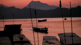 The sun sets over the Mekong River in Luang Prabang, Laos' ancient royal capital.