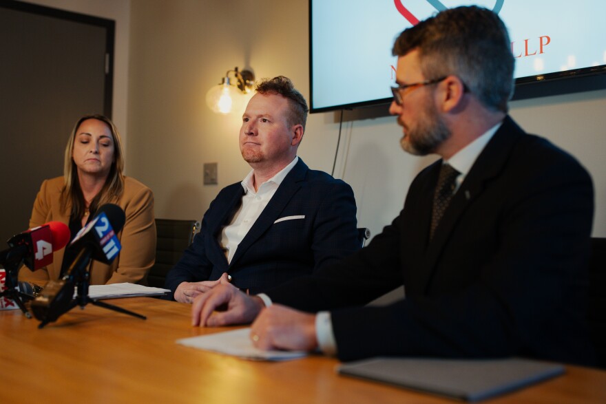 Recently-fired St. Louis Sheriff’s Deputy Tony Kirchner, who is currently running for the city’s 1st Ward aldermanic seat, speaks while flanked by his attorneys at the Newton Barth Law Firm on Thursday, Feb. 20, 2025, in downtown St. Louis.