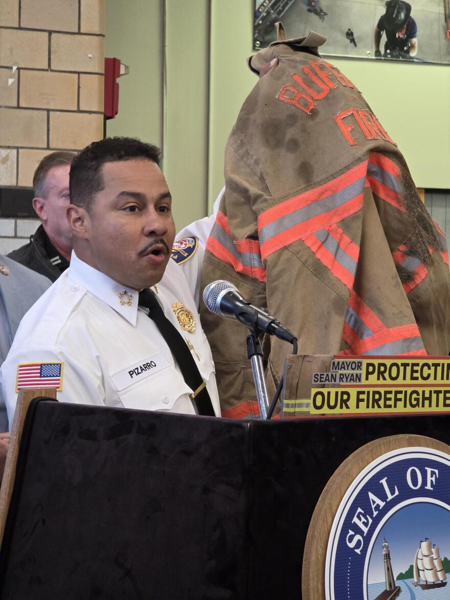 Buffalo Fire Department Commissioner Daniel Pizarro shows newer turnout gear used by a Buffalo firefighter