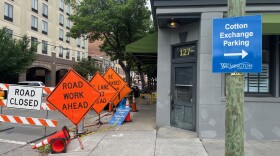 Road closures on 2nd Street facing North Front. Signage in blue is posted to tell pedestrians that N. Front businesses are open.