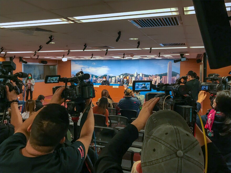 The daily press briefing from the Hong Kong health department. On the left of the podium is Dr. Chuang Shuk-kwan, head of the communicable disease branch, which tries to track down people who may have been exposed to the virus.