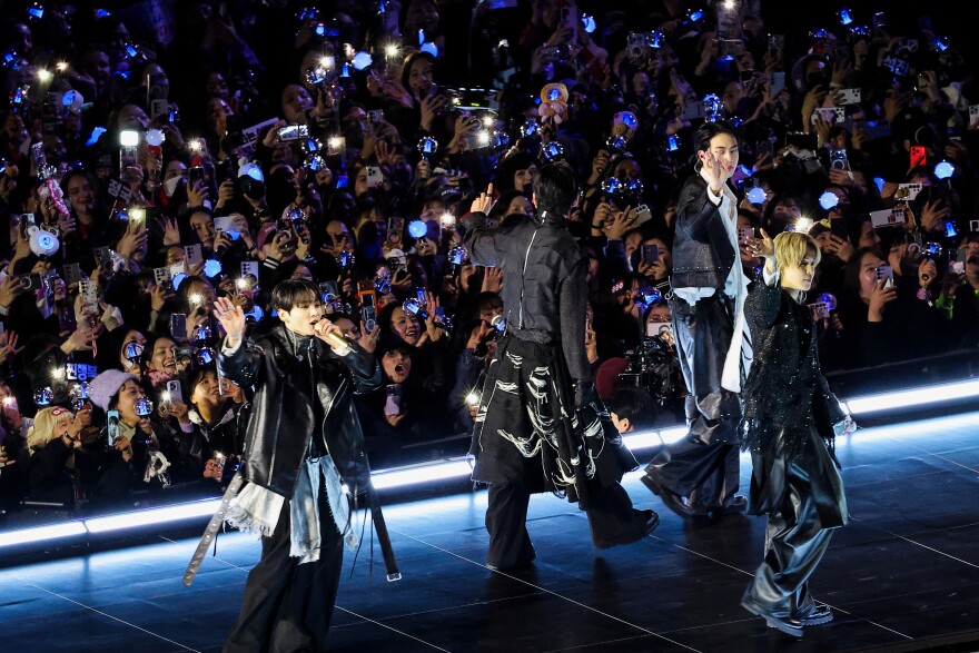 K-pop group BTS waves at the end of their 'BTS The Comeback Live Arirang' concert in central Seoul, South Korea, March 21, 2026.