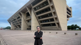 Pulitzer Prize winning architecture critic Mark Lamster stands outside Dallas City Hall, a building designed by renowned architect I.M. Pei.