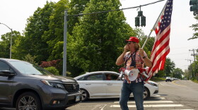 Protest against a new measure recently signed into law by Gov. Ned Lamont, which bans the open carrying of firearms, former West Hartford Town Council member Joe Visconti protests outside University of Hartford during the National Safer Communities Summit.