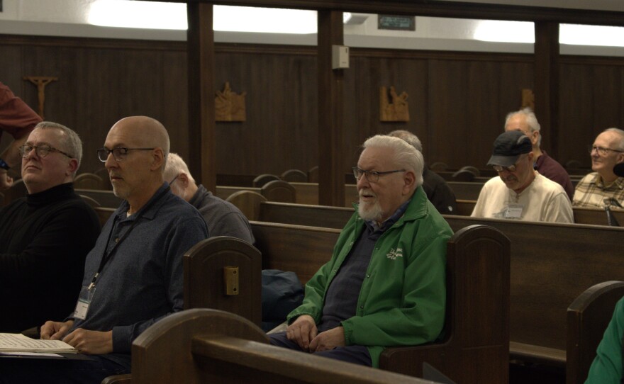 Tenor Michael Beery, a 54-year-member of the Gleemen, hears notes from Director John Jantzi on Feb. 17, 2026.