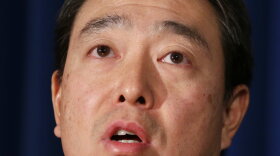 Joon H. Kim, who was acting U.S. Attorney for the Southern District of New York, speaks to reporters during a news conference in New York on Dec. 12, 2017.