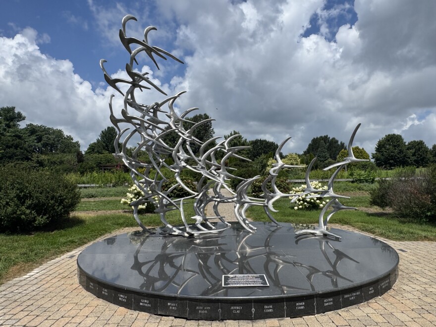 The Comair Flight 5191 sculpture at The Arboretum State Botanical Garden of Kentucky in Lexington, designed by sculptor Douwe Blumberg, honors those killed in the crash with 49 birds taking flight. Each bird contains mementos from loved ones sealed inside.