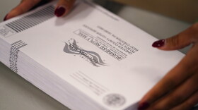 A Chester County election worker processes ballots for the Pennsylvania primary election at the Chester County Voter Services office, Thursday, May 19, 2022, in West Chester, Pa. 