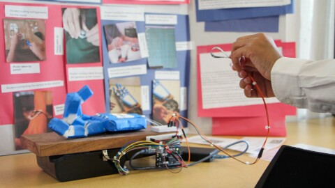 Jett Jones uses a flex sensor, a resistor, and a microcontroller to control a robotic hand’s jointed fingers.