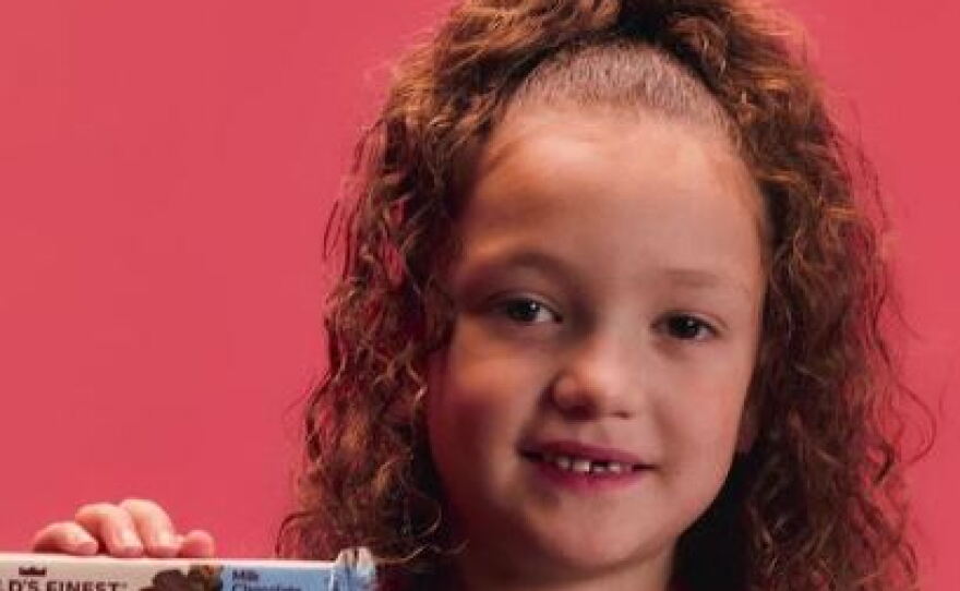 Kameryn De La Garza, 7, sold 45 boxes' worth of World's Finest Chocolate candy bars to benefit her school.