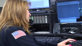 This is a picture of an emergency dispatcher at work