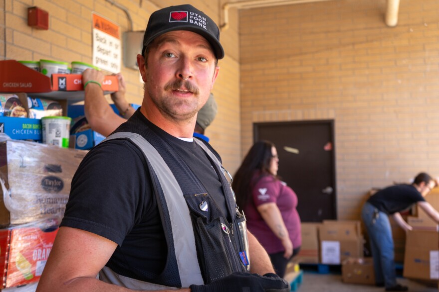 Pryor works with a network of food bank employees, grocers and volunteers. At the end of his route this day, the staff at Volunteers for America helped him unload donations.