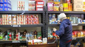 Pat Mabe a volunteer at Serve Wenatchee loads the food pantry Wednesday, Nov. 5, at Trinity United Methodist Church in East Wenatchee.