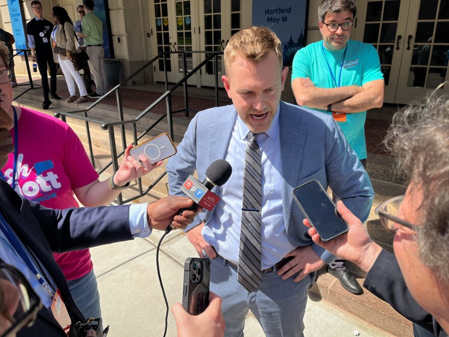 State Rep. Josh Elliott, D-Hamden and candidate for governor talks with reporters outside State Democratic Convention, Saturday, May 16, 2026, in Hartford Conn.