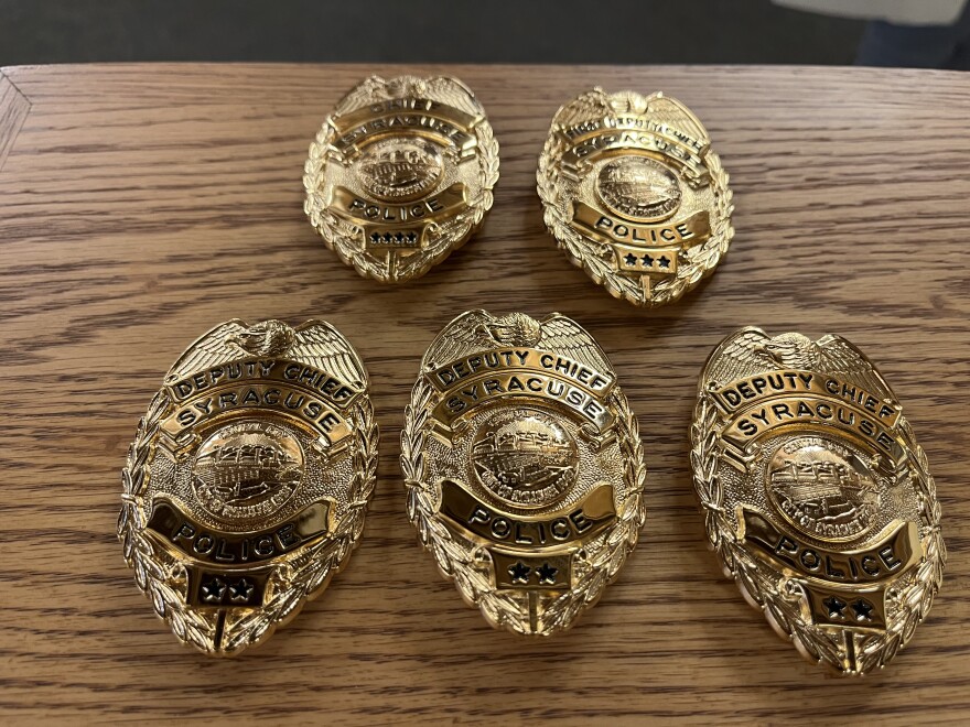 The new badges for chief and first deputy chief, top, and deputy chief, bottom.