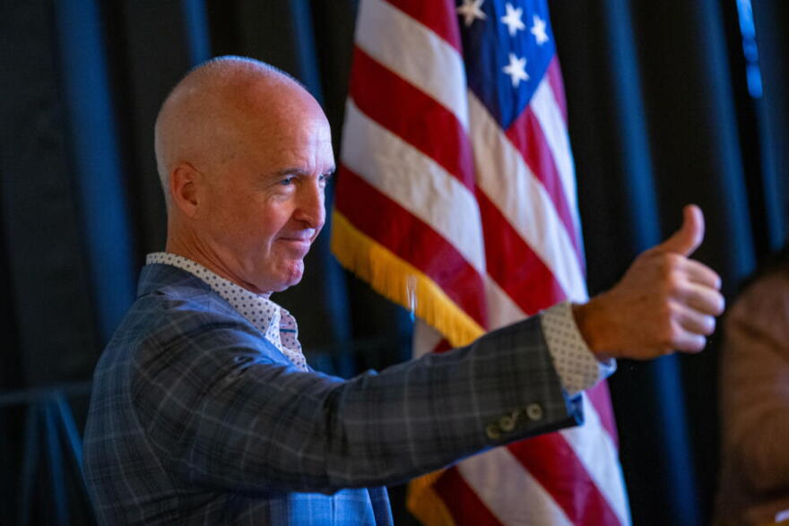 Republican gubernatorial candidate Mike Minogue gives a thumbs up during his introduction at the Cape Cod Republican Women's Luncheon at the Yarmouth House Restaurant in April. (Jesse Costa/WBUR)
