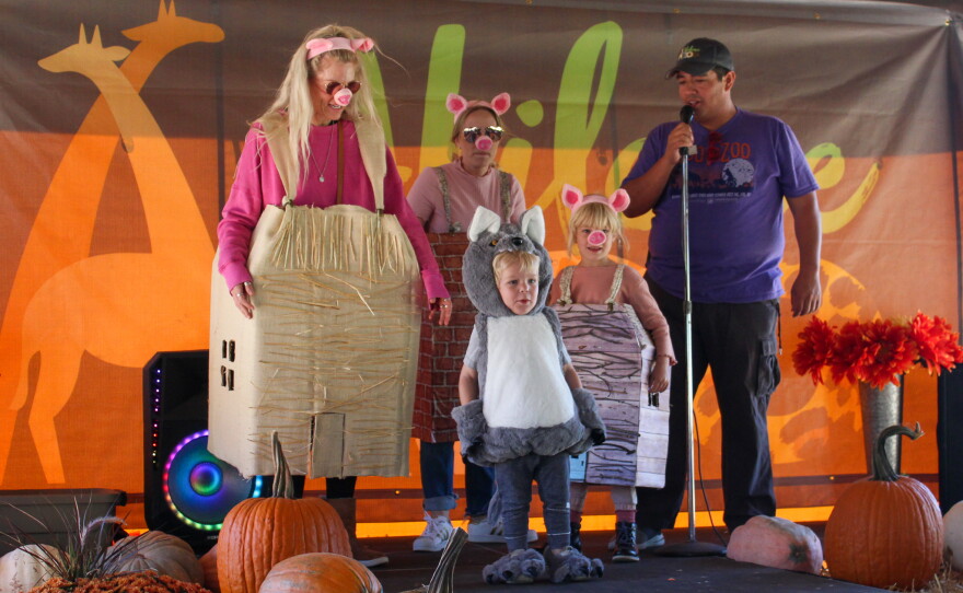 The three little pigs and the big bad wolf entered the costume contest.