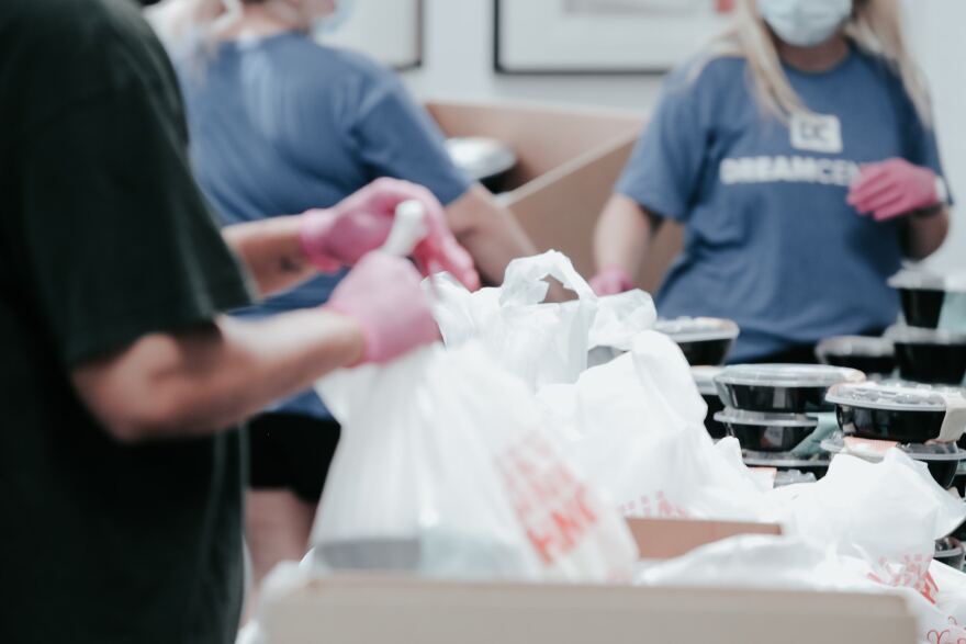 Volunteers with food baskets.