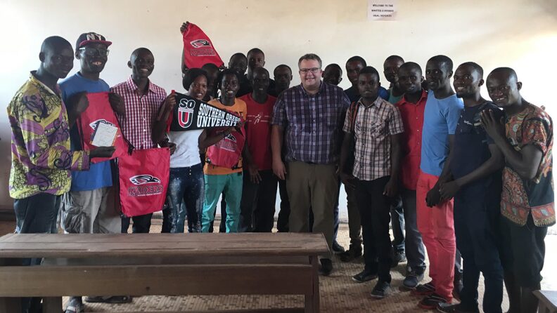 Dr. Bryce Smedley poses with a group in the Central African Republic in 2018.
