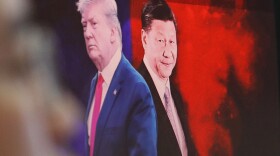 A computer screen in Seoul shows images of Chinese President Xi Jinping and President Donald Trump in 2019. Ahn Young-joon/AP