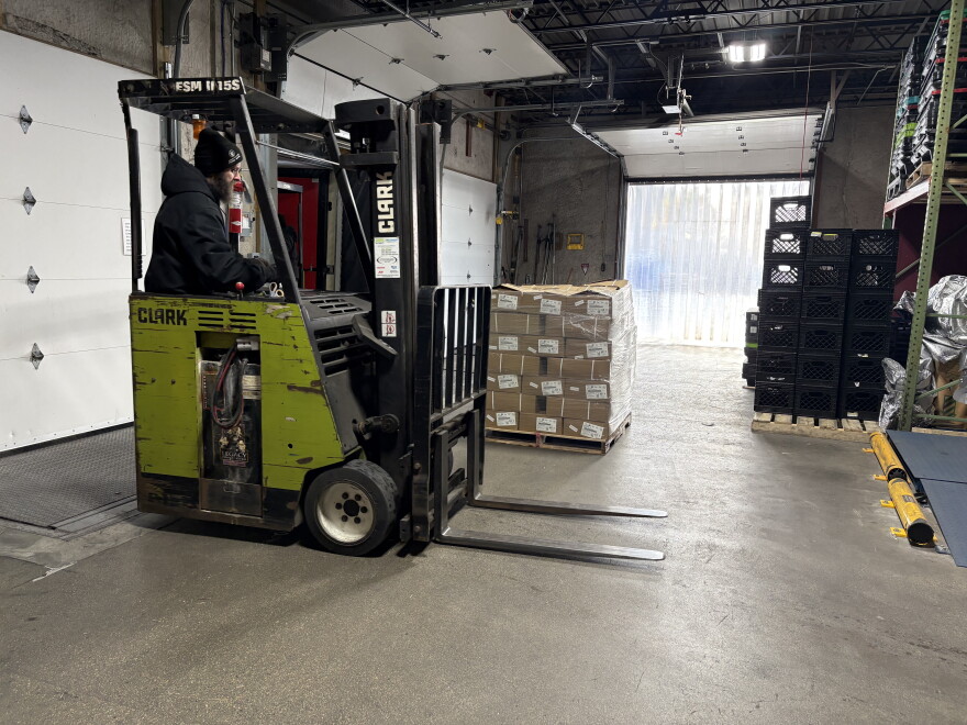 40,000 pounds of spare ribs being unloaded at the Great Plains Food Bank.