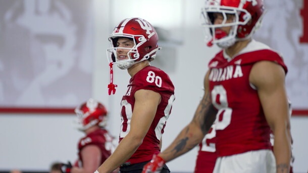 Indiana wide receivers Charlie Becker (left) and Nick Marsh walk the field during the first day of spring football practice Thursday.
