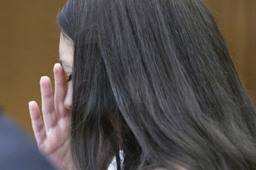 Lindsay Clancy listens to medical testimony from doctors who treated her children during her trial. Clancy, 36, does not deny she killed her three young children, but her attorney argues she should not be held criminally responsible because she was suffering from postpartum psychosis when she strangled them.