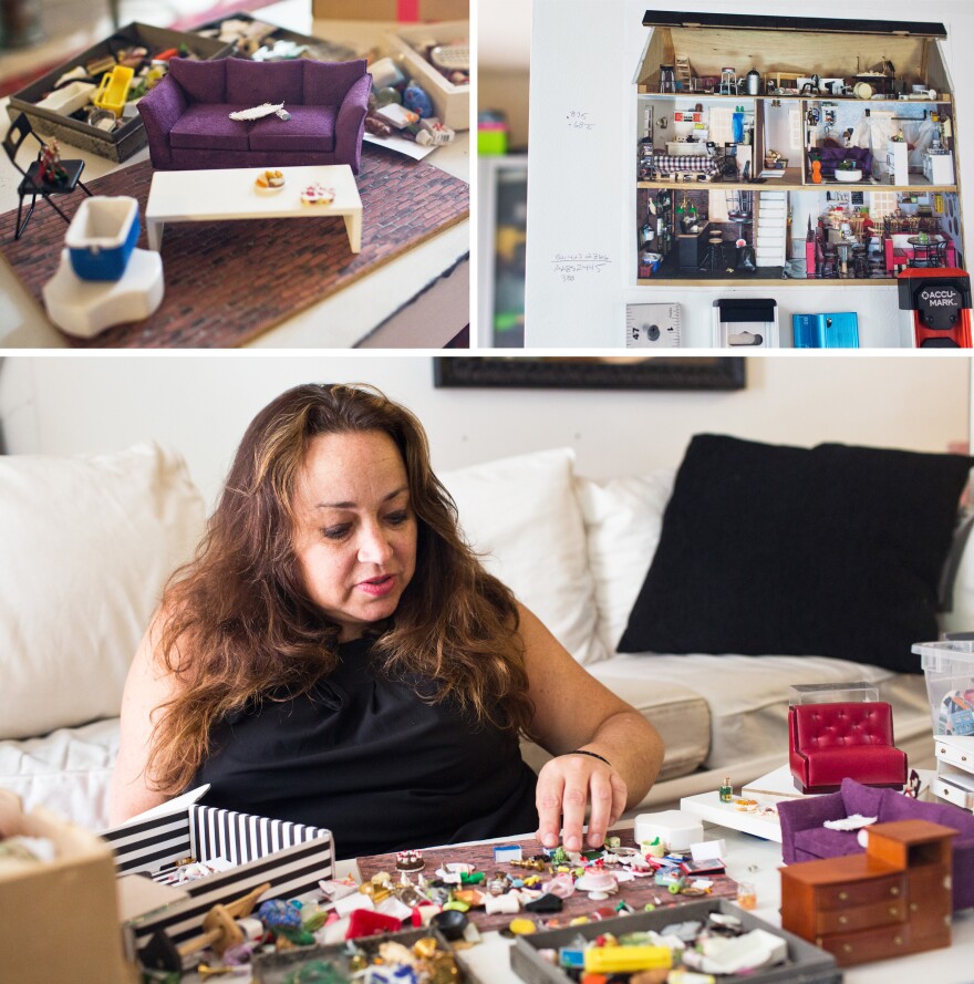 Bridget Sue Lambert (bottom) arranges dollhouse furniture in her apartment and studio in Washington, D.C. Lambert uses miniature furniture and dollhouses to stage and photograph scenes. Her piece <em>#unicornsarereal</em> is featured in the National Building Museum's "Small Stories: At Home In A Dollhouse" exhibit.