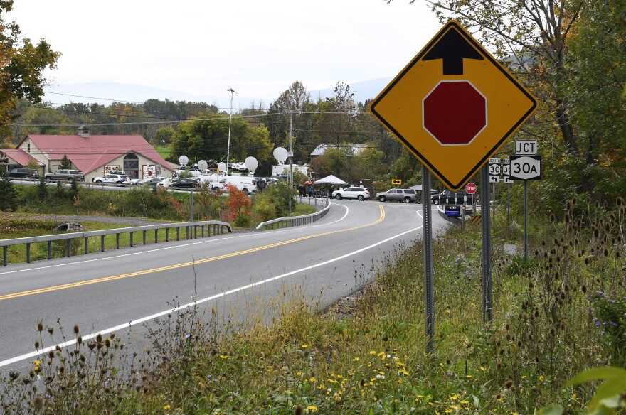 News trucks park at the site of the limousine crash that killed 20 people in Schoharie, N.Y., on Saturday. The National Transportation Safety Board is investigating the accident.