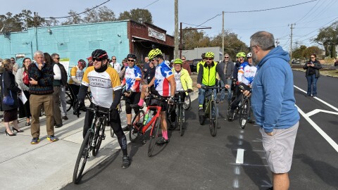 Cyclists celebrate the new bike lanes with an inaugural ride.
