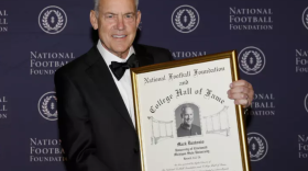 Mark Dantonio with plaque for the College Football Hall of Fame
