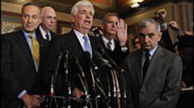 Senate Banking Committee Chairman Christopher Dodd (center) speaks during a news conference Thursday following a meeting on Capitol Hill about the market turmoil.