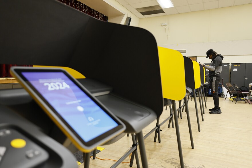 Brandon Ellerby casts his ballot during the Super Tuesday primary election at the Boyle Heights Senior Center in Boyle Heights, Calif.