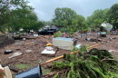 Sandy Creek flooding in Travis County on July 5, 2025, left debris strewn across a small orchard