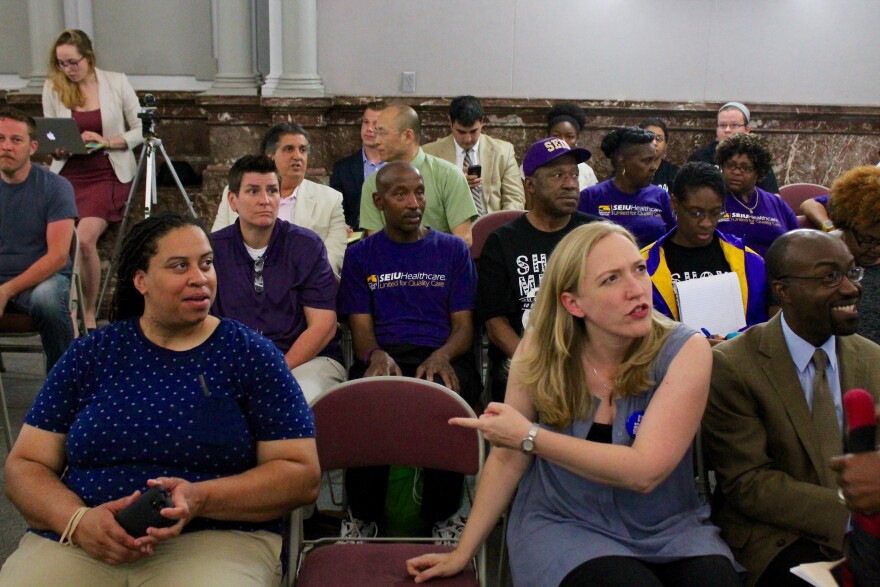 Supporters of a city minimum wage hike sit through a hearing of the St. Louis Board of Aldermen Ways and Means Committee.