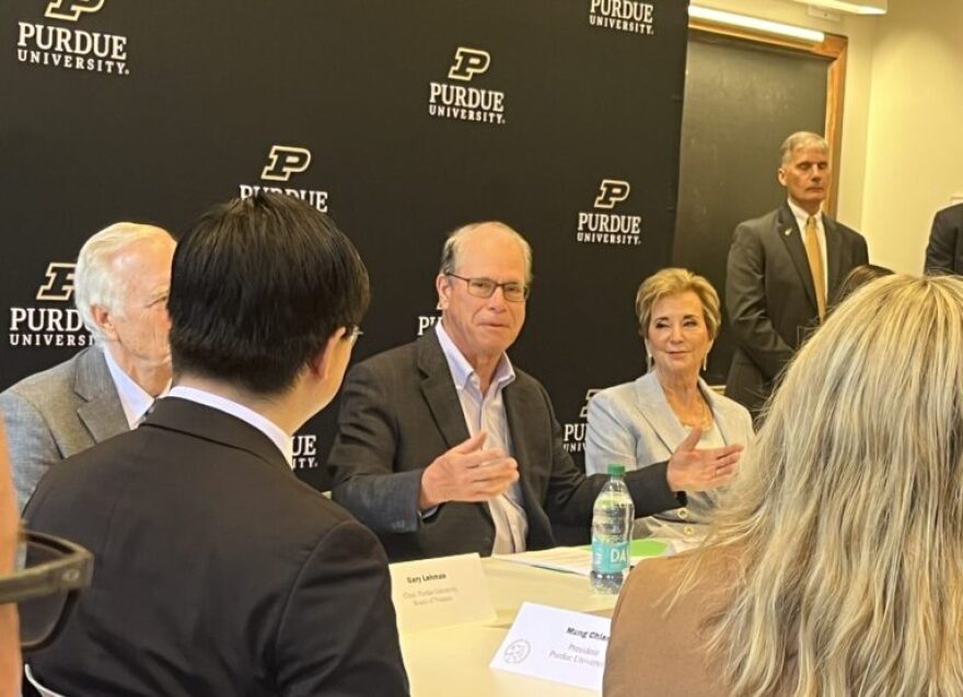 Gov. Mike Braun chats at a Purdue University roundtable on July 16, 2025 next to U.S. Secretary of State Linda McMahon.