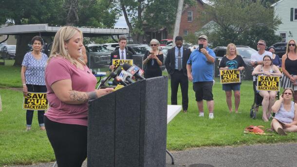 Lexi Hawk, speaking at lectern, describes her concern with possible contamination at her home in Niagara County