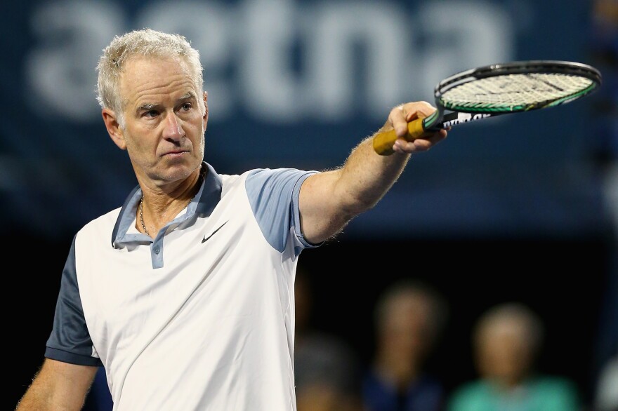 John McEnroe reacts during a Men's Legends match against Jim Courier at the Connecticut Open in August 2015.