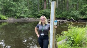 Deena Hoffman takes measurements at the Beaver Brook stream gage each week.