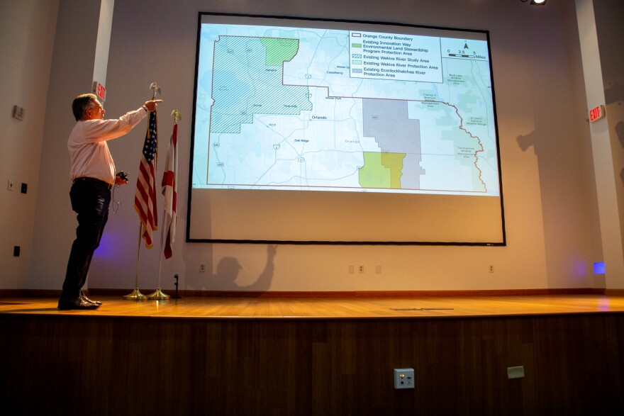 Orange County Environmental Policy Coordinator Alan Marshall points to a presentation slide showing where Orange County's existing Special Protection Areas, or SPAs, are.