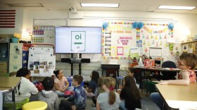 Second grade students sit on the floor in Deanna Dunn's classroom at Ptarmigan Elementary School in Anchorage.
