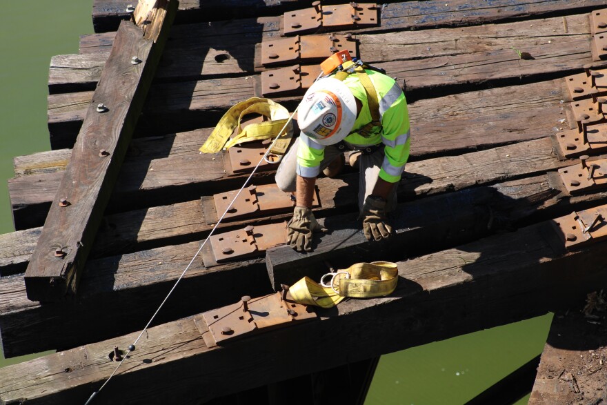 Crews were out working Thursday to repair a portion of the track destroyed by a derailment that sent two train cars into the Wabash River (WBAA News/Ben Thorp)&#13;
 