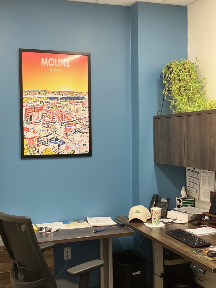 A new office in the City Services Center includes a Moline poster.