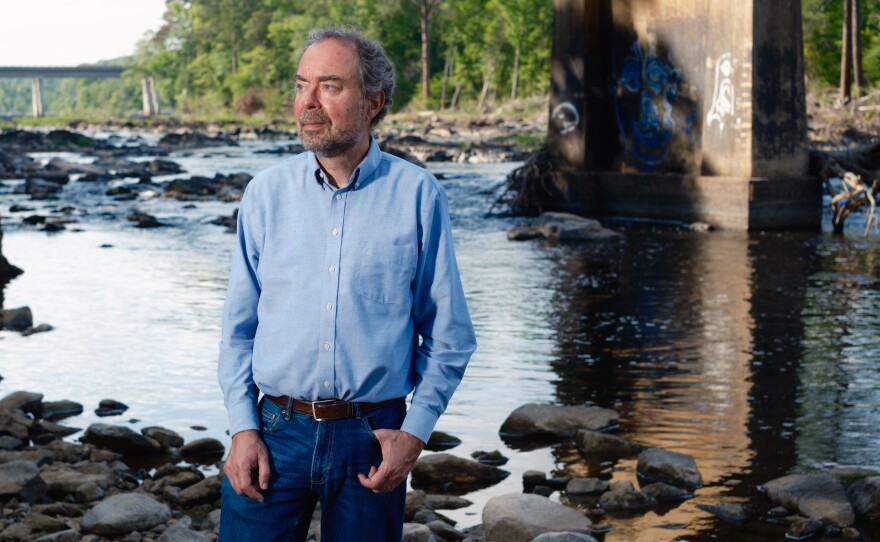 Detlef Knappe, a professor and scientist at N.C. State University who studies PFAS, stands for a portrait at the Haw River in Bynum, N.C. on April 29, 2026.