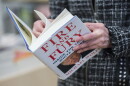 A man holds a copy of the book "Fire and Fury: Inside the Trump White House" by Michael Wolff, after buying it at a bookstore in Washington, D.C. on Jan. 5, 2018. The book was rushed into bookstores and onto e-book platforms four days ahead of schedule due to what its publisher called "unprecedented demand" — and after Trump's bid to block it failed. (Andrew Caballero-Reynolds/AFP/Getty Images)
