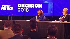 A photo from the televised debate between Republican incumbent George Holding and Democratic challenger Linda Coleman.