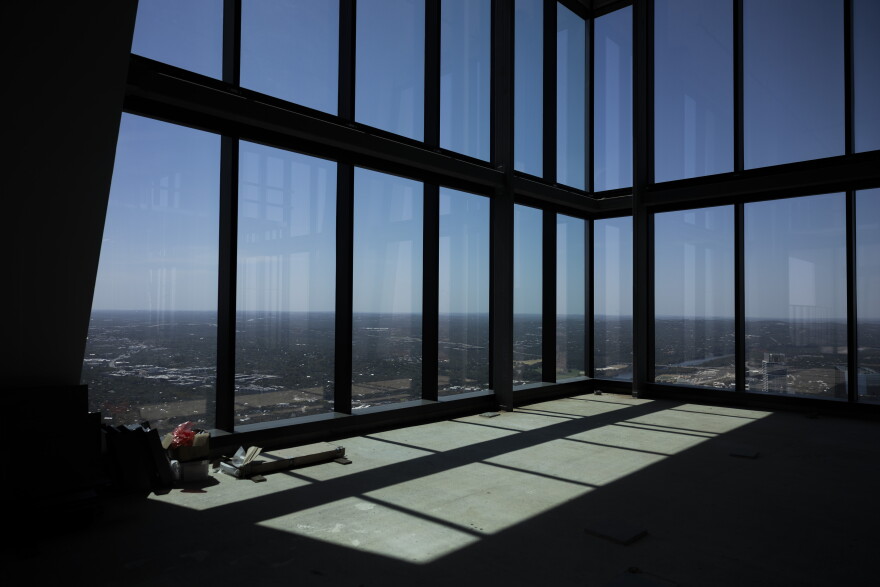 A view of the city and hill country sits outside the penthouse windows at the Waterline.